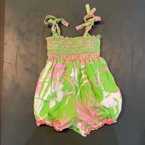 Adorable romper with buttons and ties by shoulder